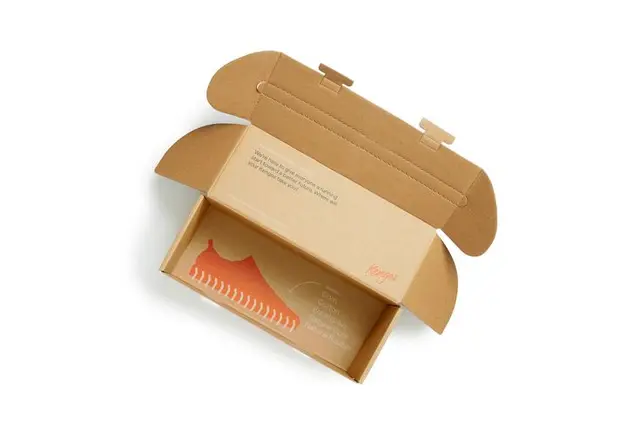 Kengos kraft shoebox with orange shoe print and polka-dot tissue (DIELINE)