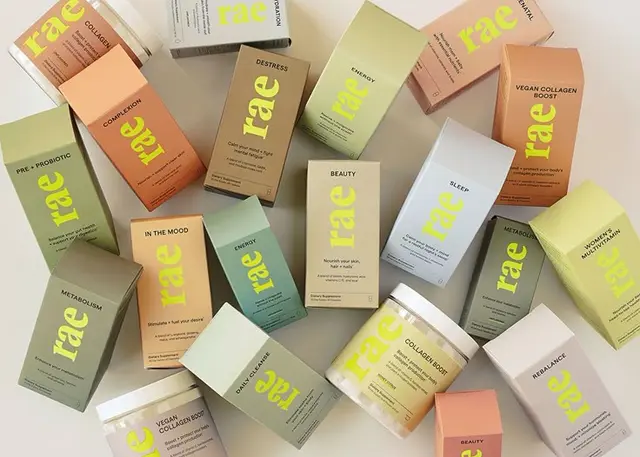 Rae wellness supplements — pastel boxed packaging with neon logotype