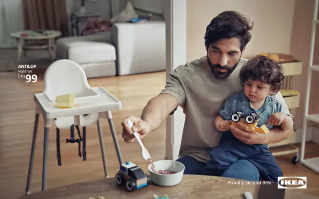 IKEA 'Proudly Second Best' ad — father feeding toddler next to ANTILOP highchair (Dhs 99)