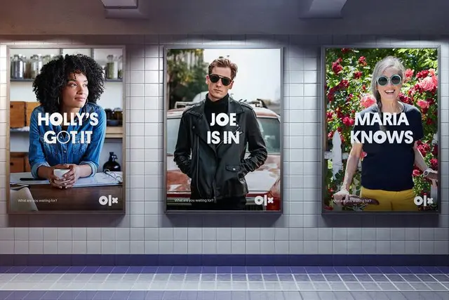 OLX identity — three illuminated subway posters with bold white headlines ('HOLLY'S GOT IT