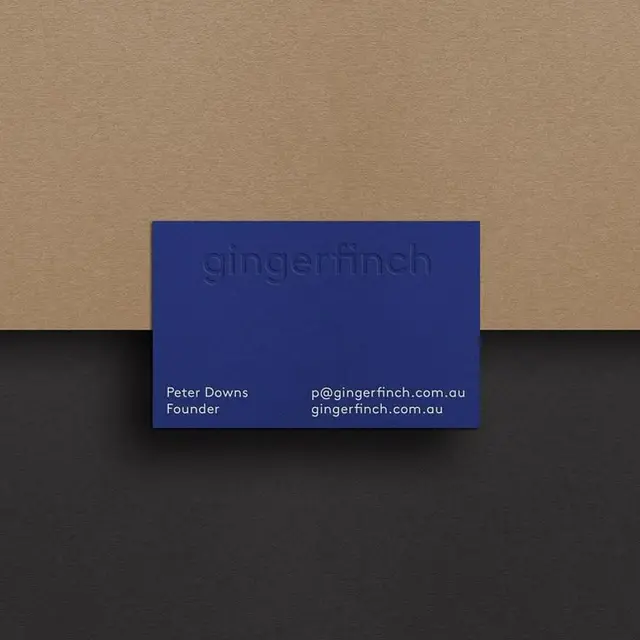 Gingerfinch cobalt debossed business card on kraft and charcoal paper