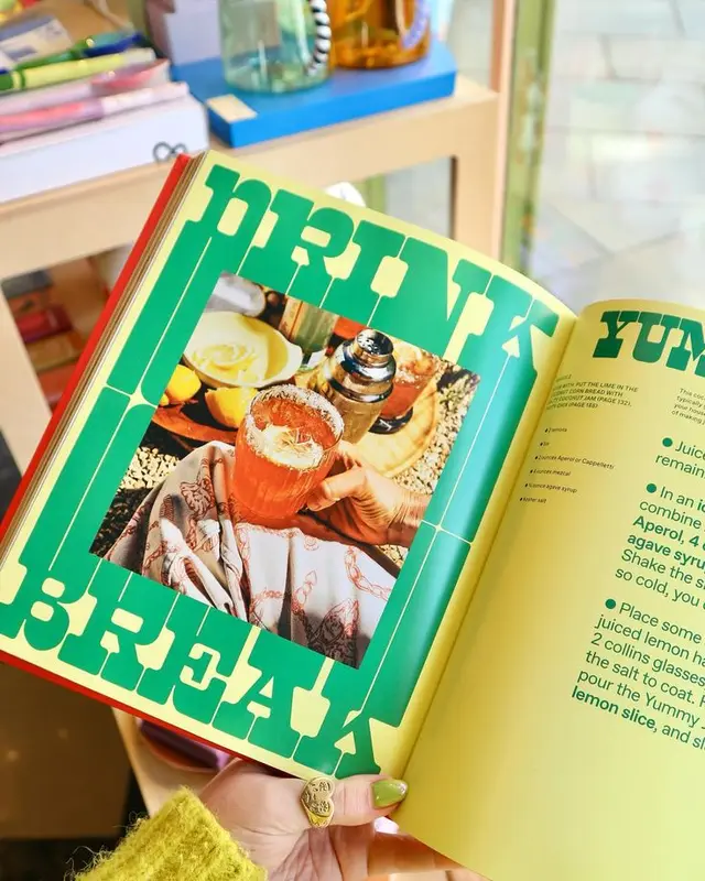 Open recipe spread: bold green DRINK BREAK headline with pink cocktail photo