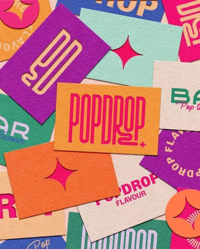 POP DROP branding cards — colorful printed logo collage