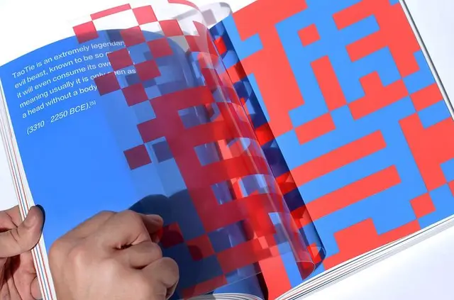 Red-and-blue pixel grid art book spread with translucent acetate overlay