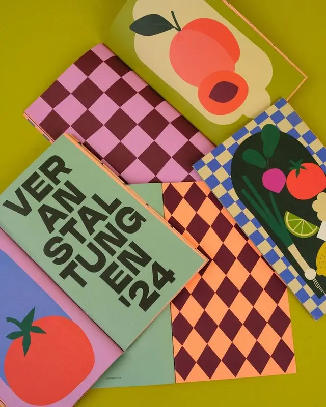 Colorful zine spreads with bold typography and fruit illustrations