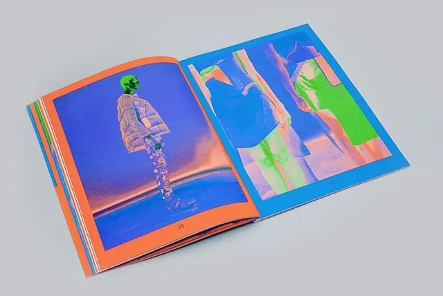 Open fashion photobook spread with neon-inverted portraits