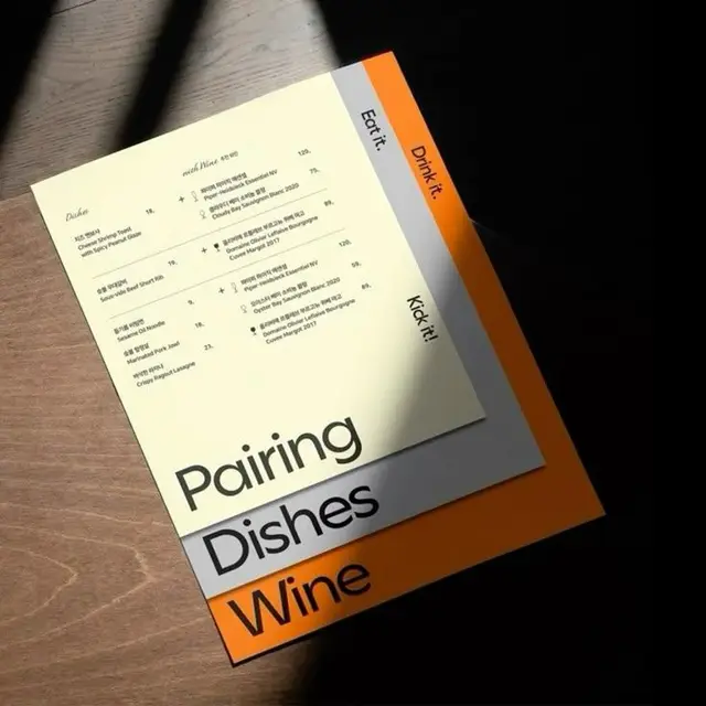 Pairing Dishes Wine — layered printed menu cards with orange accent