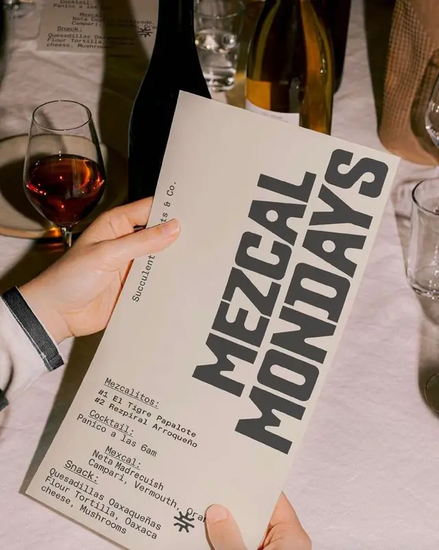 Mezcal Mondays event menu with wine and table setting