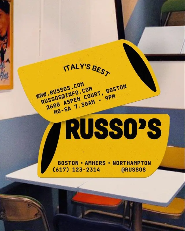 Yellow RUSSO'S promotional stickers on retro diner table