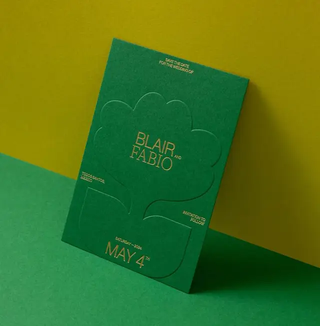 Emerald green letterpress save-the-date with embossed tree and gold foil type