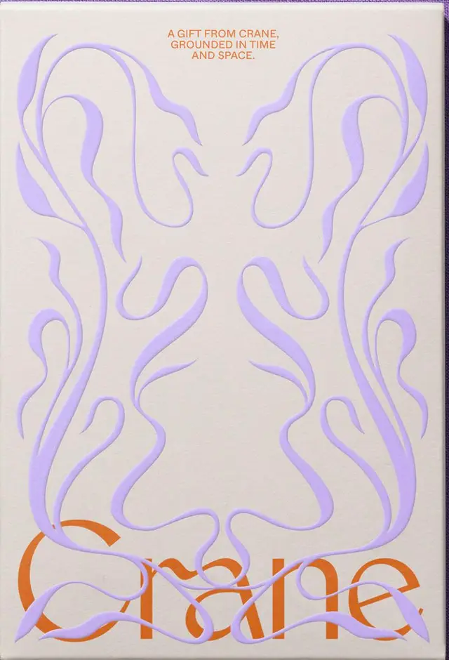 Crane embossed gift box — lavender organic motif with orange logotype