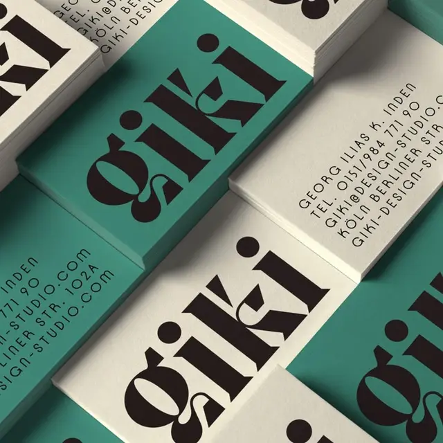 Teal and off-white business cards with bold serif 'giki' logo