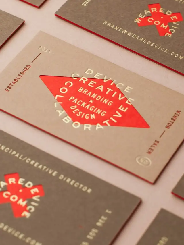We Are Device business cards — red diamond logo on kraft and charcoal stock