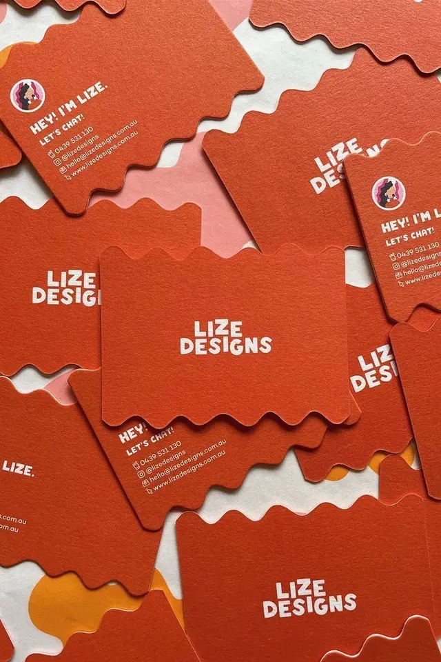 Lize Designs terracotta scalloped business cards with bold white logotype