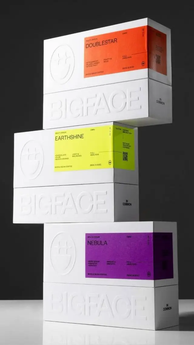BIGFACE stacked coffee boxes with neon color-block labels