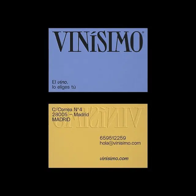 VINÍSIMO business cards — blue logo card and mustard contact card with embossing