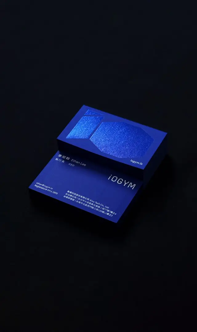 Cobalt-blue embossed business cards for iOGYM