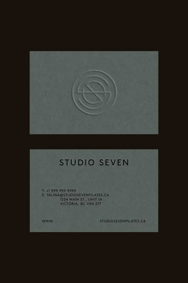 Studio Seven embossed business card — minimalist Pilates studio identity