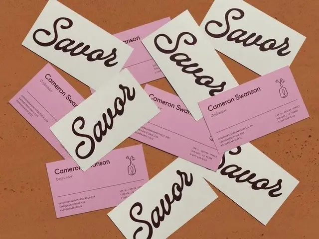 Savor branding — white script logo cards and pink Cameron Swanson business cards