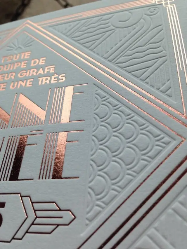 Pale-blue embossed cardstock with rose-gold foil — Art Deco close-up