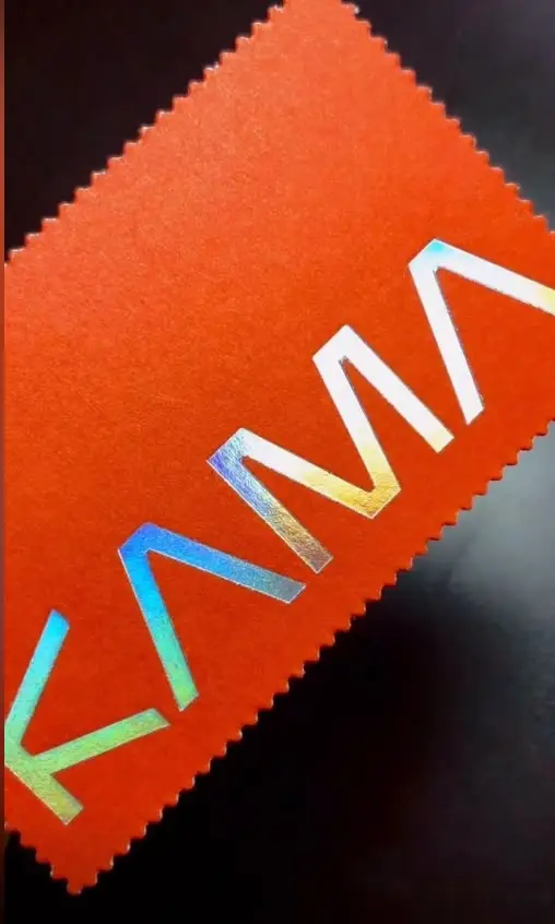 Orange textured cardstock swatch with holographic foil lettering