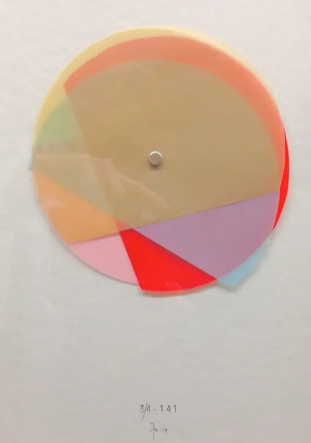 Layered translucent disc color study mounted with central pin
