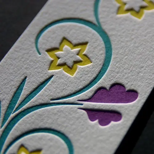 Letterpress-style die-cut floral on textured cotton paper