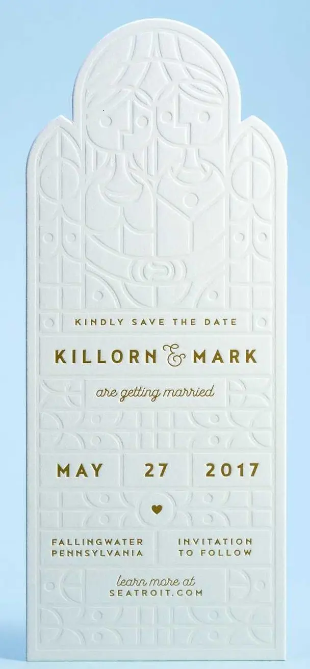 Embossed arched save-the-date card with gold foil text