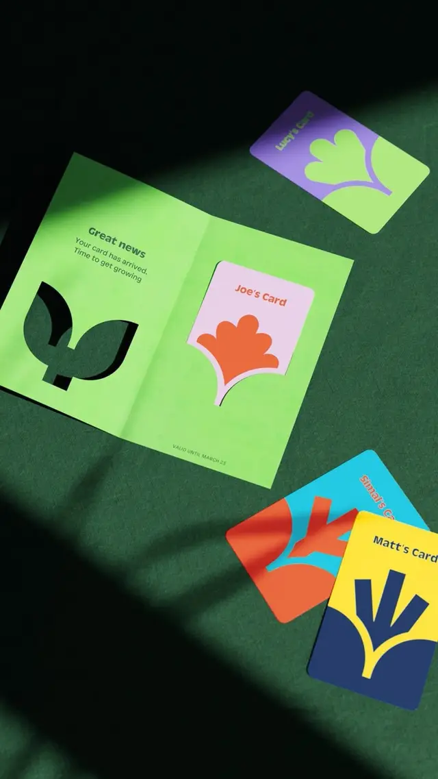 Lime-green die-cut welcome mailer with colorful plant-motif cards