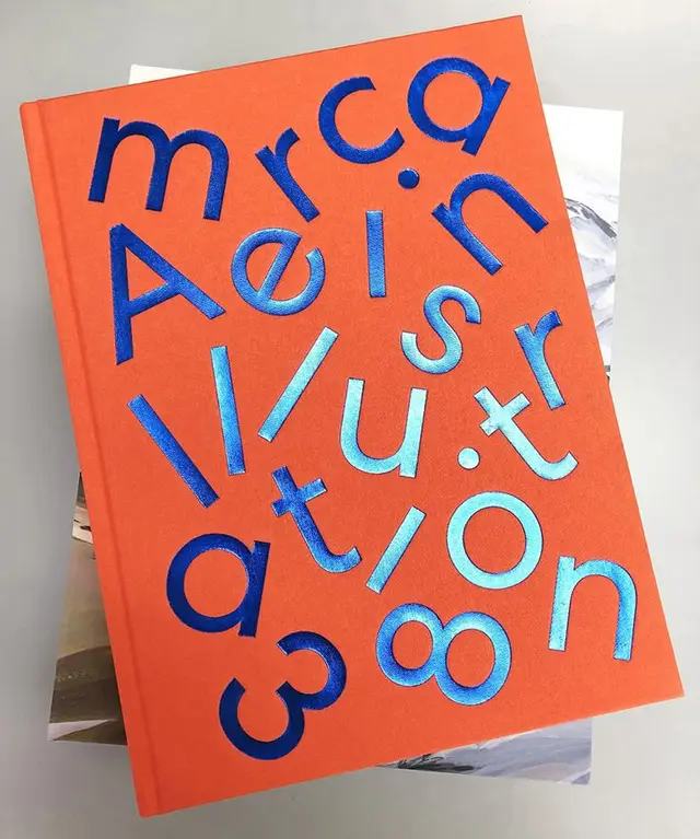 Orange cloth hardcover with metallic blue typographic cover