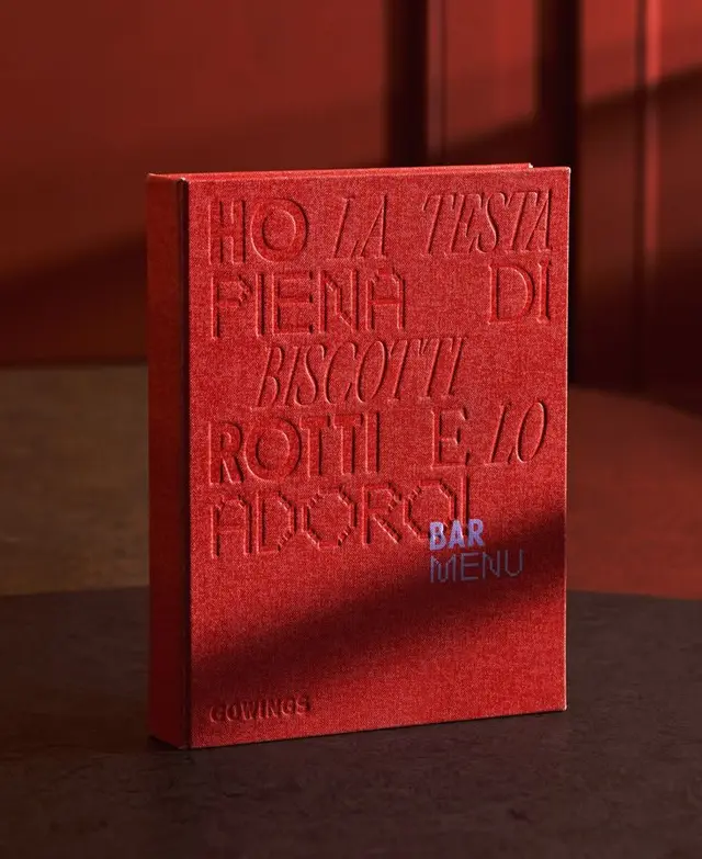 Red embossed linen bar menu with Italian typographic cover