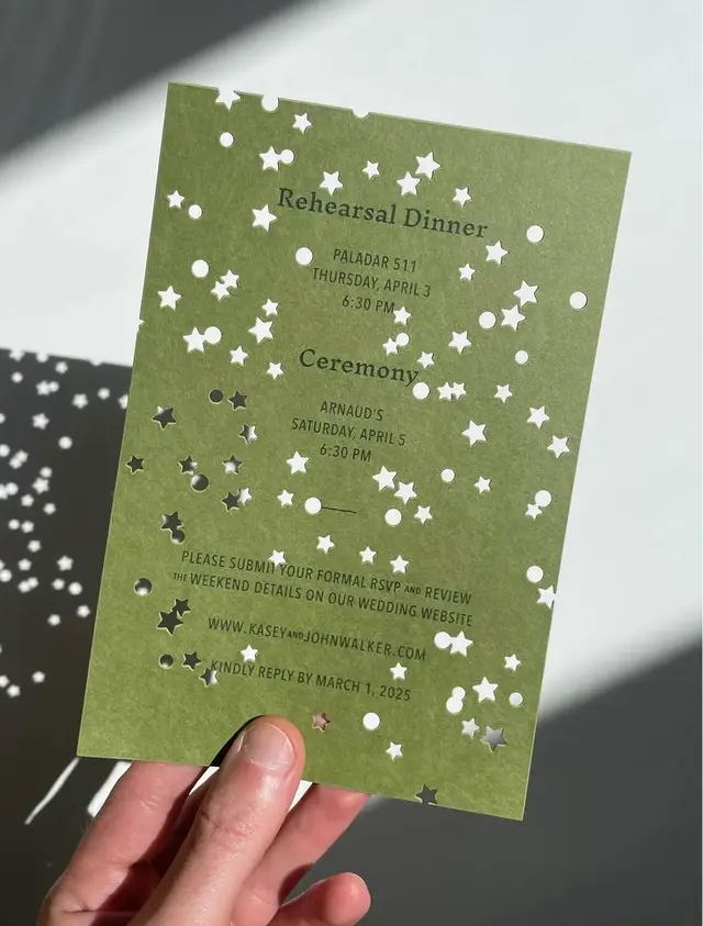 Olive-green wedding invitation with star and circle die-cut pattern