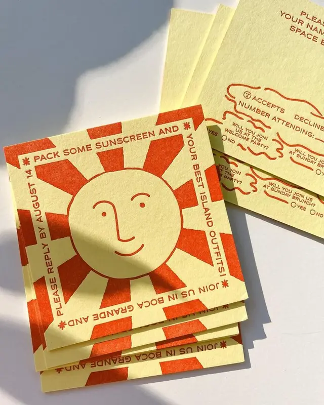 Yellow letterpress RSVP cards with orange sunburst illustration