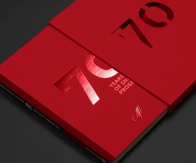 70th Anniversary Red Slipcase Book with Die-cut Foil Numeral