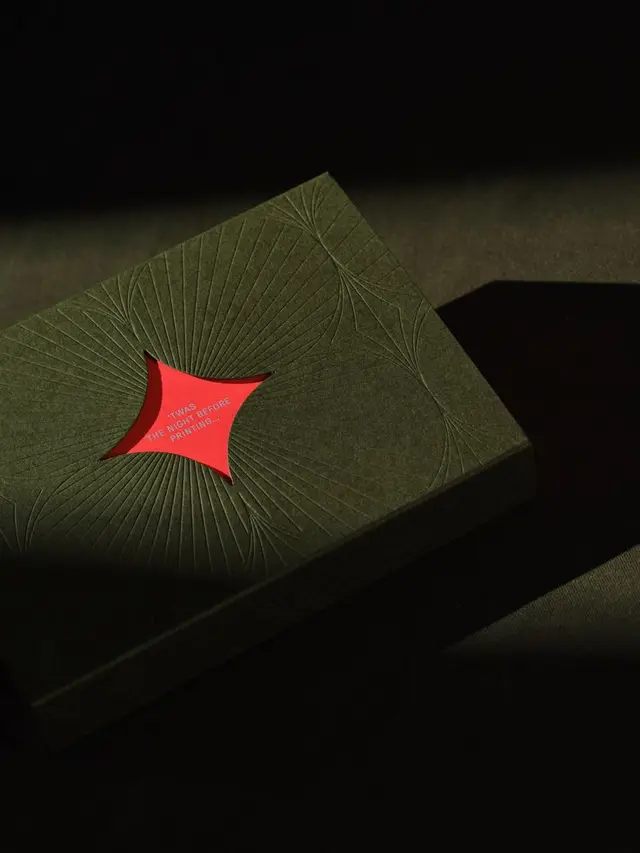 Matte dark green embossed box with red die-cut window