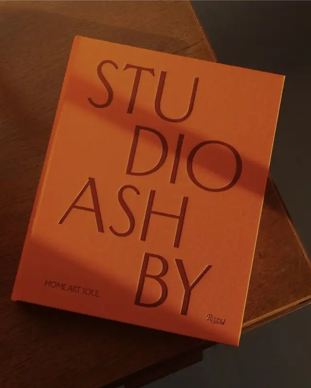 Studio Ashby — orange Rizzoli hardcover on wooden table