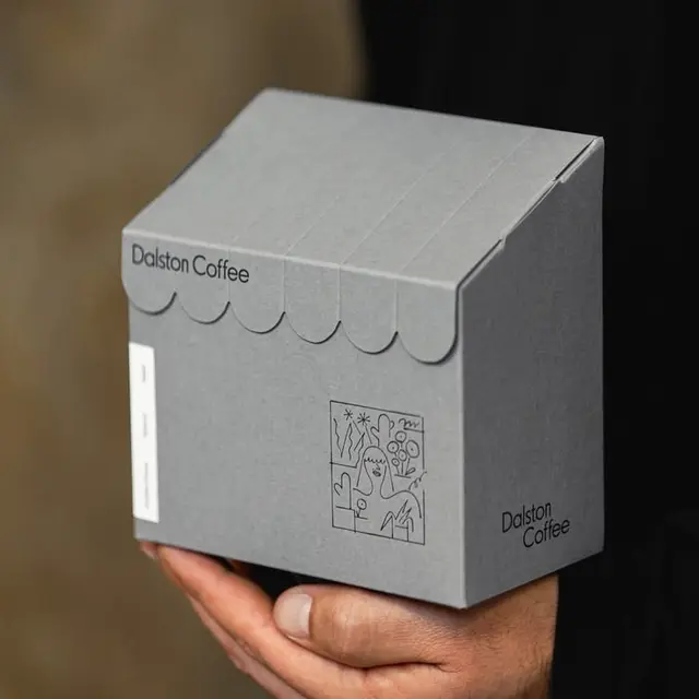 Dalston Coffee grey scalloped awning cardboard box