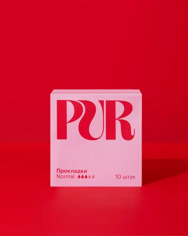PUR pink packaging — sanitary pads box on red background