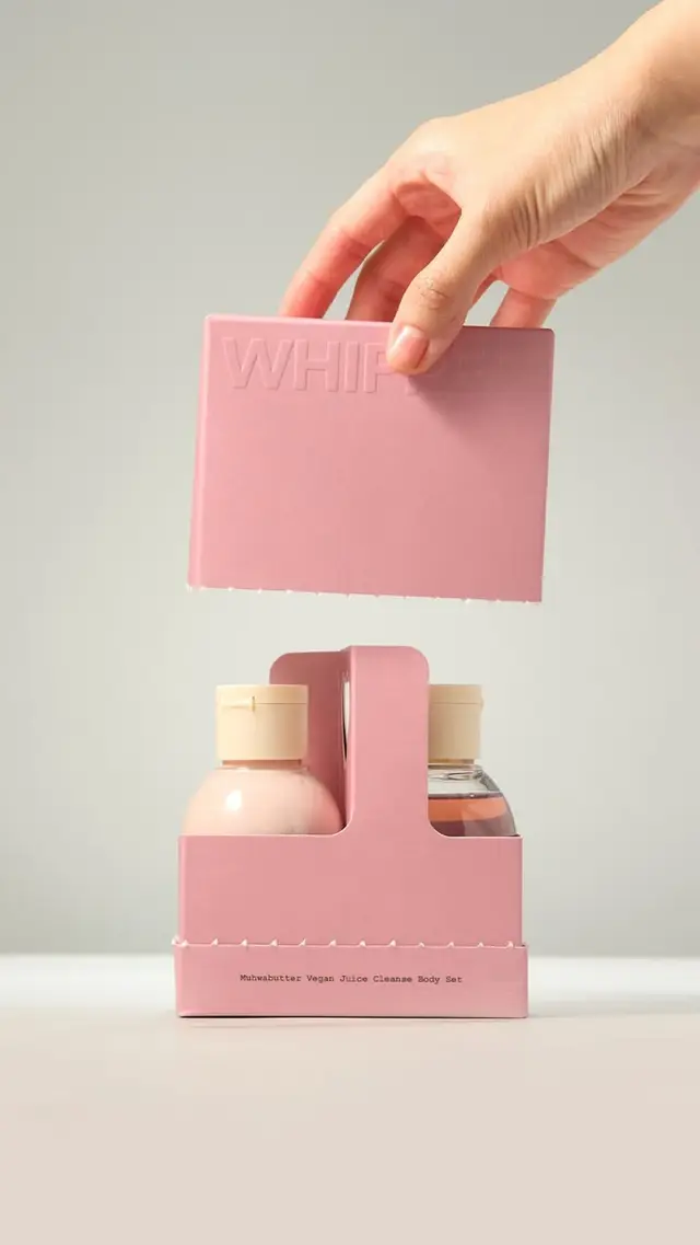 Pastel pink paperboard skincare gift set with embossed 'WHIP' lid