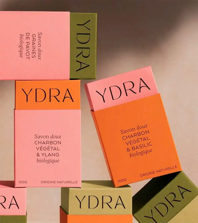 YDRA boxed soap packaging — stacked pink, orange and olive product shot