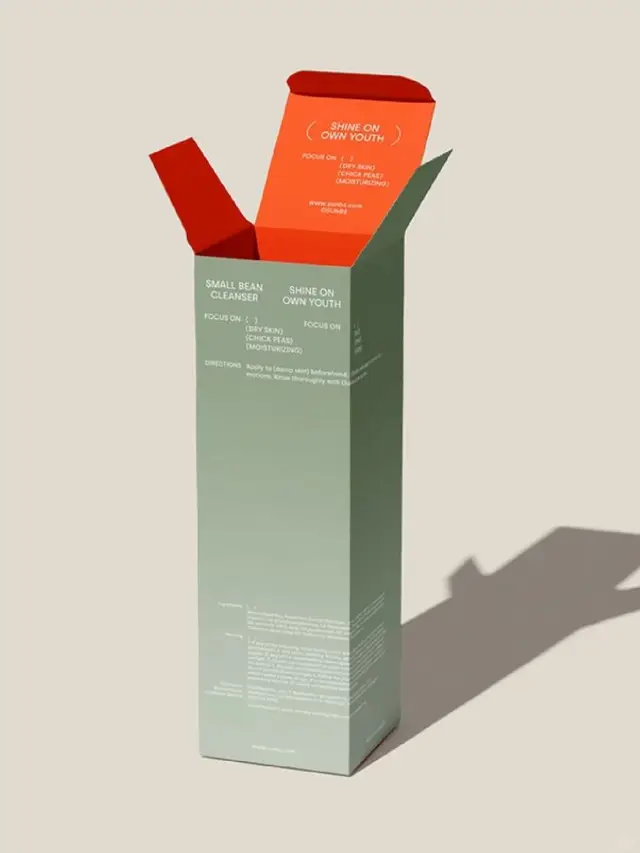 Sage-green skincare box with orange interior — open packaging mockup