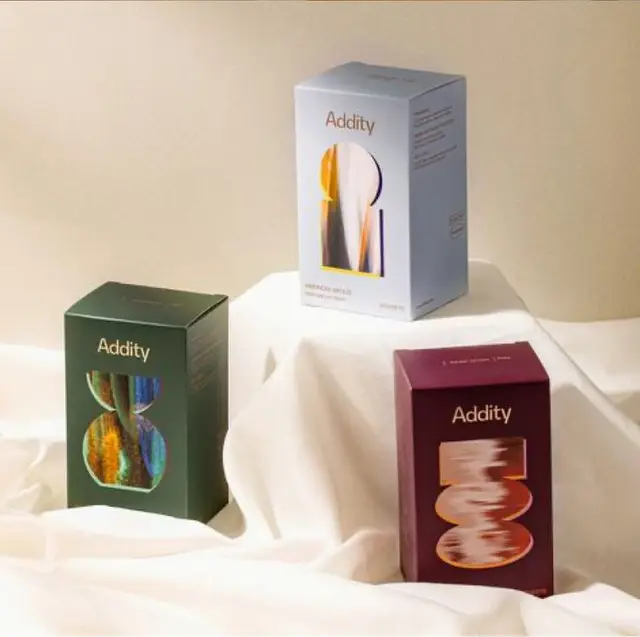 Addity product packaging trio — editorial still life