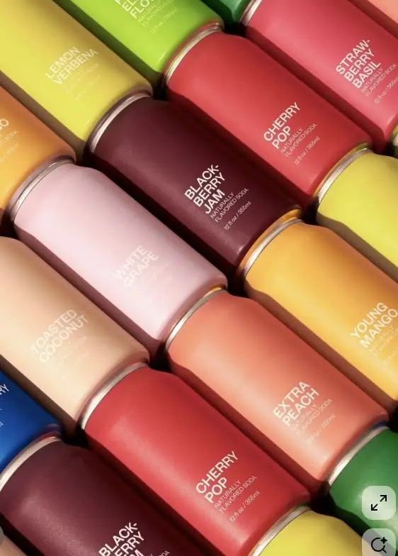 Diagonal grid of matte fruit-flavored soda cans