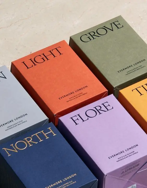Evermore London scented candle boxes — colorful serif packaging