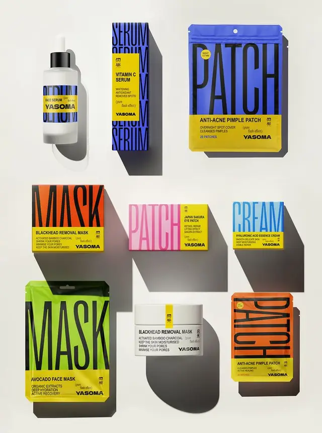 Yasoma skincare packaging flat-lay — bold typographic color-block lineup