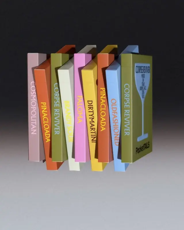 Pocket cocktail booklets — colorful stacked spines