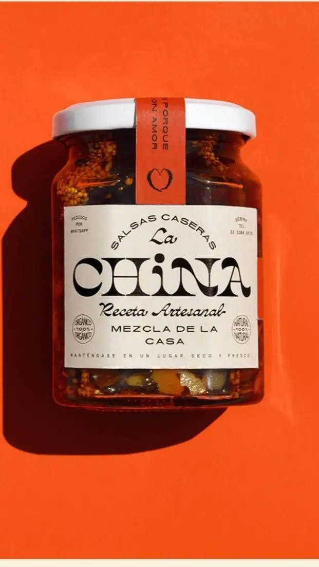 La China artisanal salsa jar on bright orange background