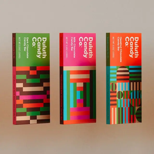 Duluth Candy Co. geometric chocolate bar packaging — three colorful boxes