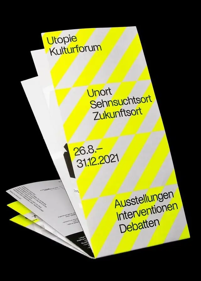 Utopie Kulturforum trifold brochure — neon yellow diagonal stripes (exhibition 2021)