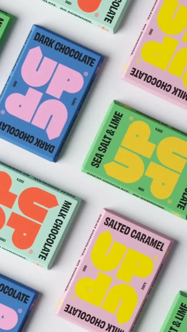 UP chocolate bars — pastel color-block packaging with oversized typographic logo